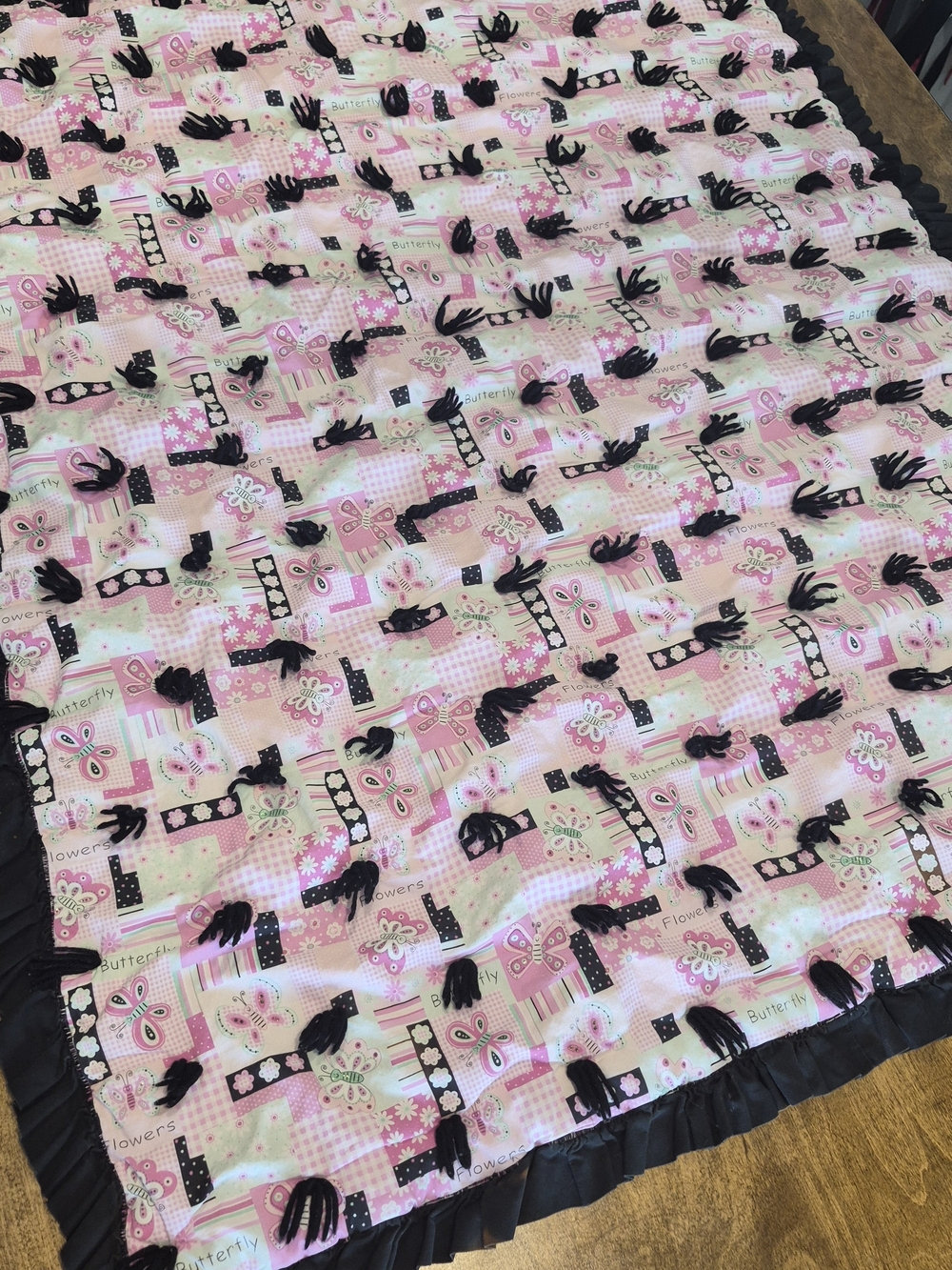 Handmade Pink Butterfly Tie-Knot Patchwork Baby Quilt with Black Ruffled Edge